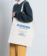 PASSION Slogan Print Boxy Canvas Tote Bag in Off White
