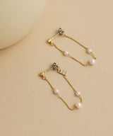 Long Pearl Strand Earrings in Gold